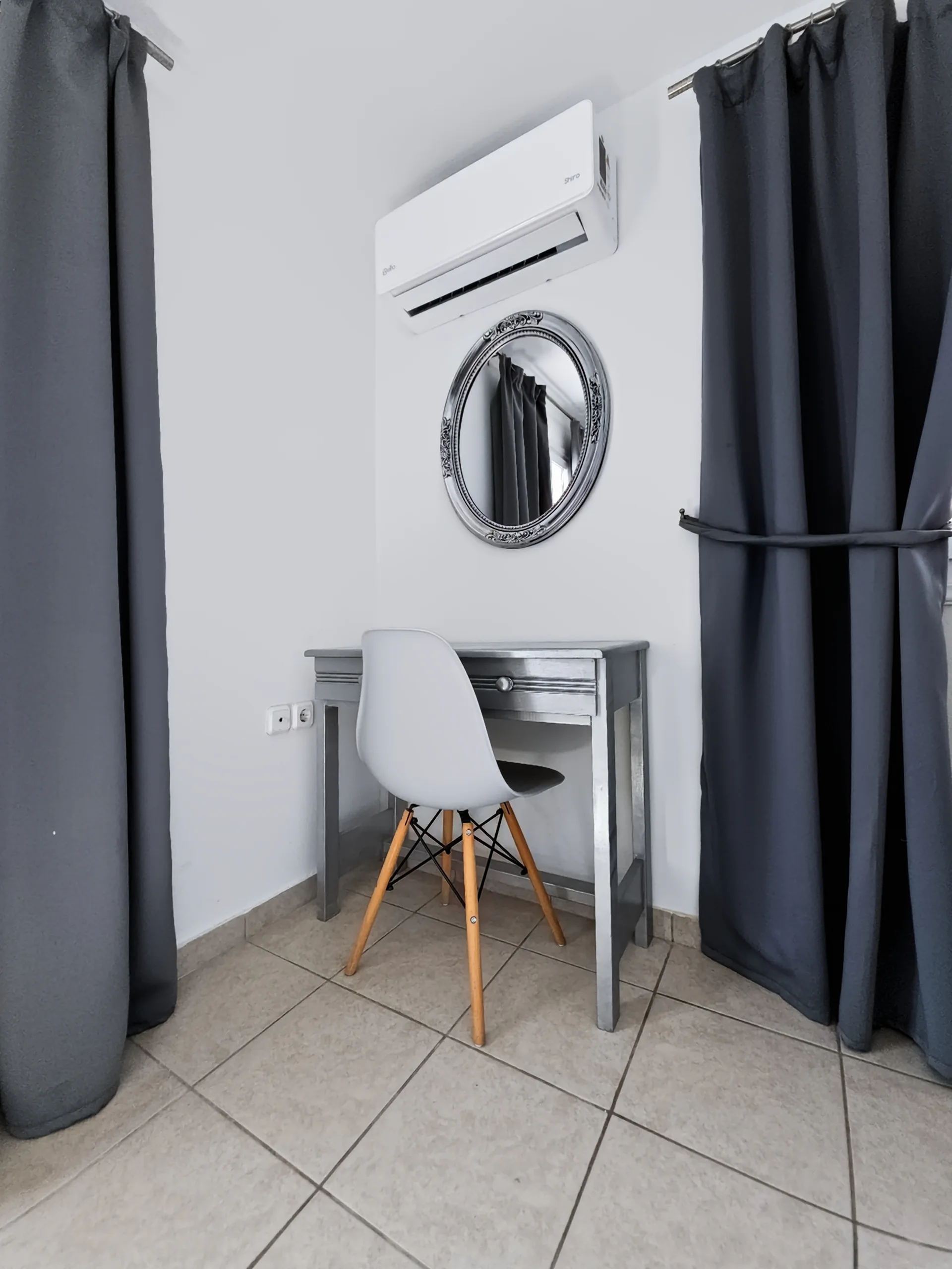 Apartment 5: dressing table and mirror beside the sleeping area