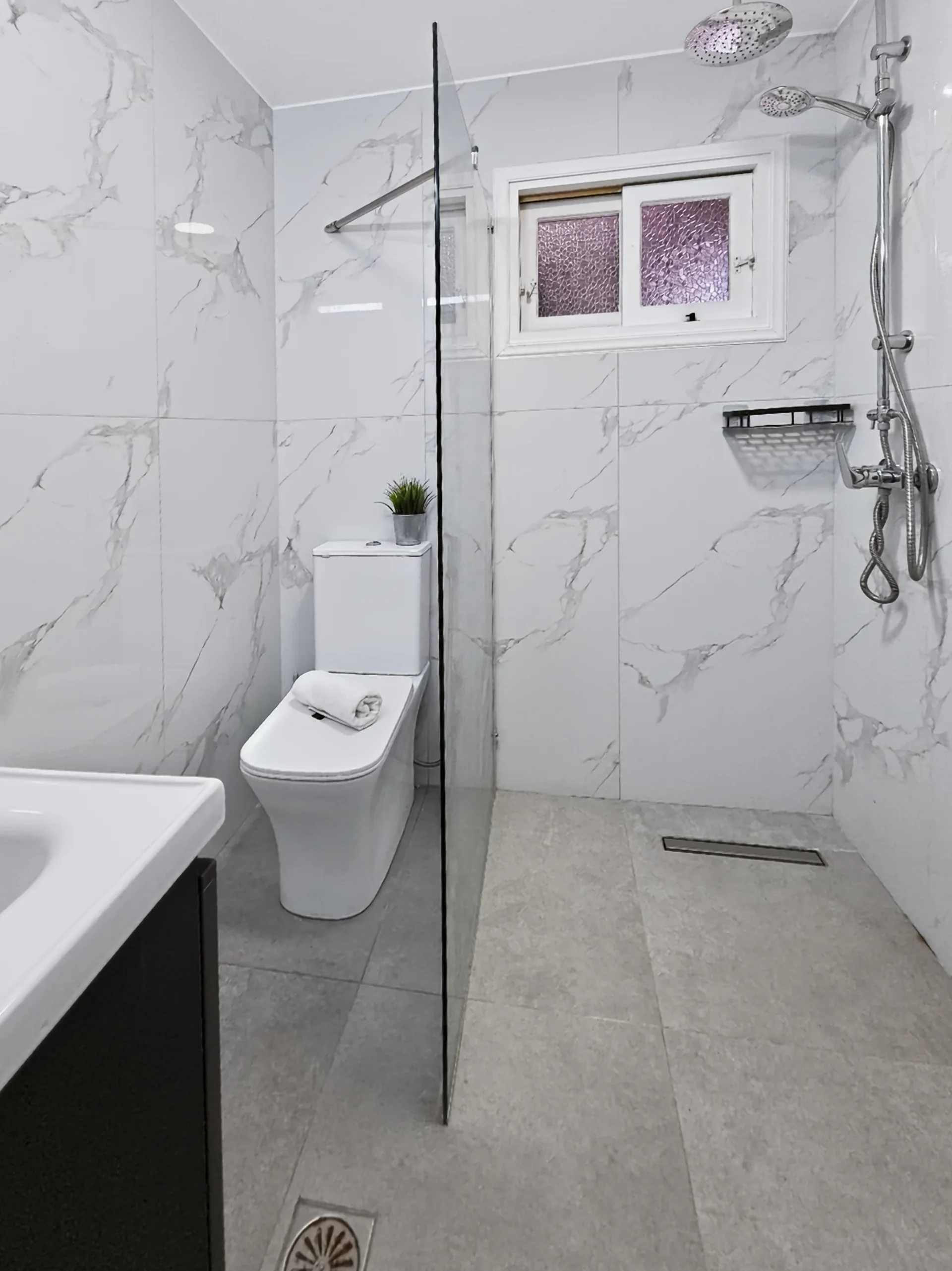 Apartment 5: bright private bathroom with a walk-in shower