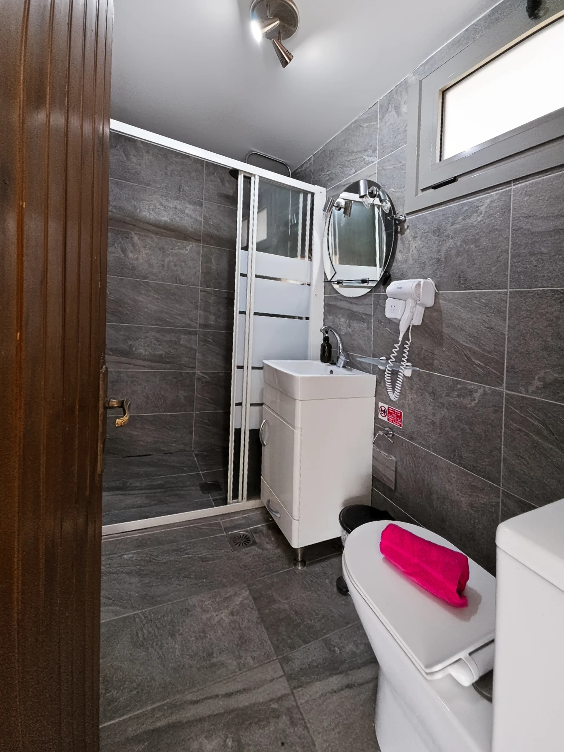 Sofita Apartment: bright private bathroom with a walk-in shower