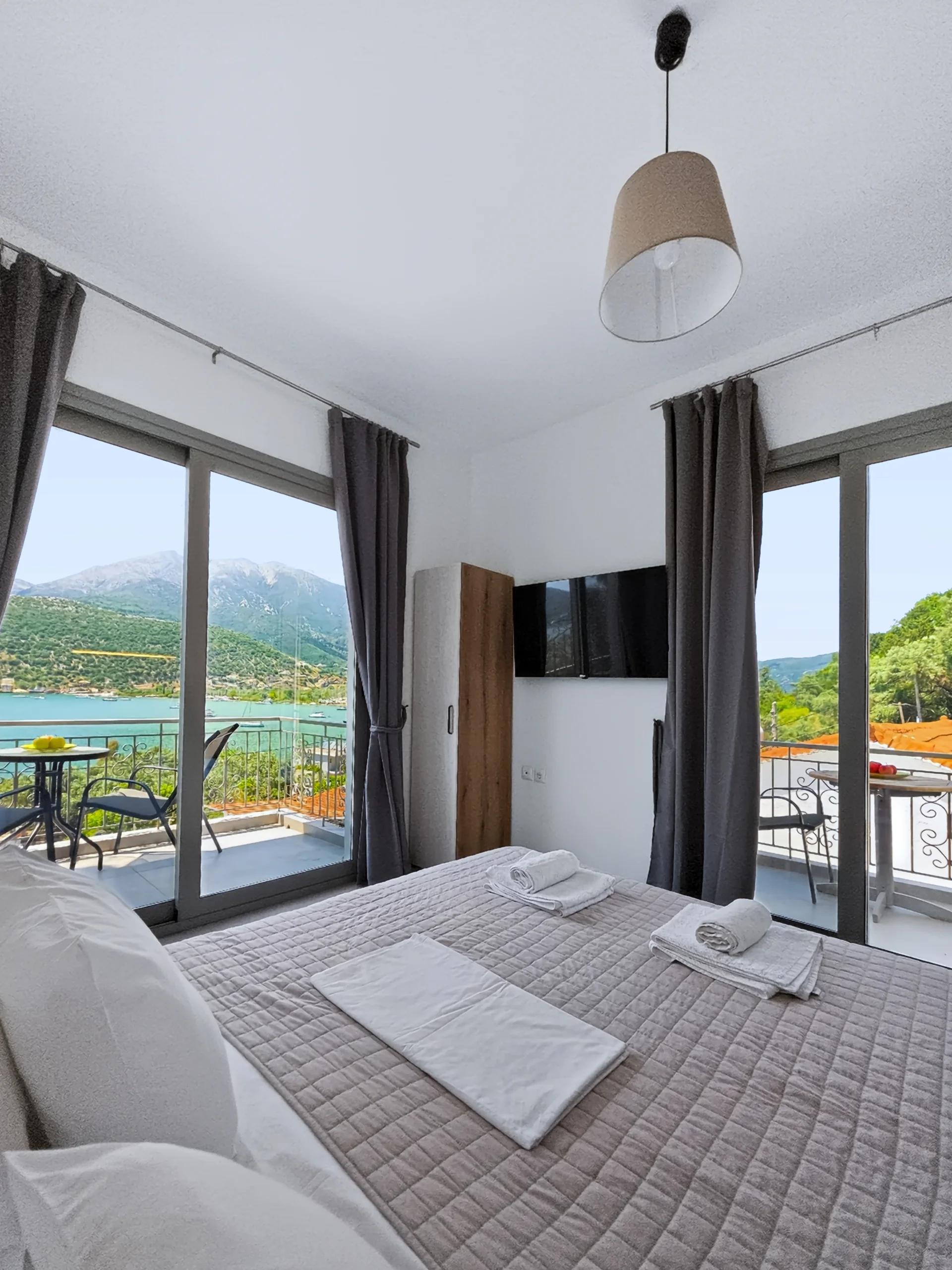 Studio 1: double bed beside the sea-view balcony in Geni, Lefkada