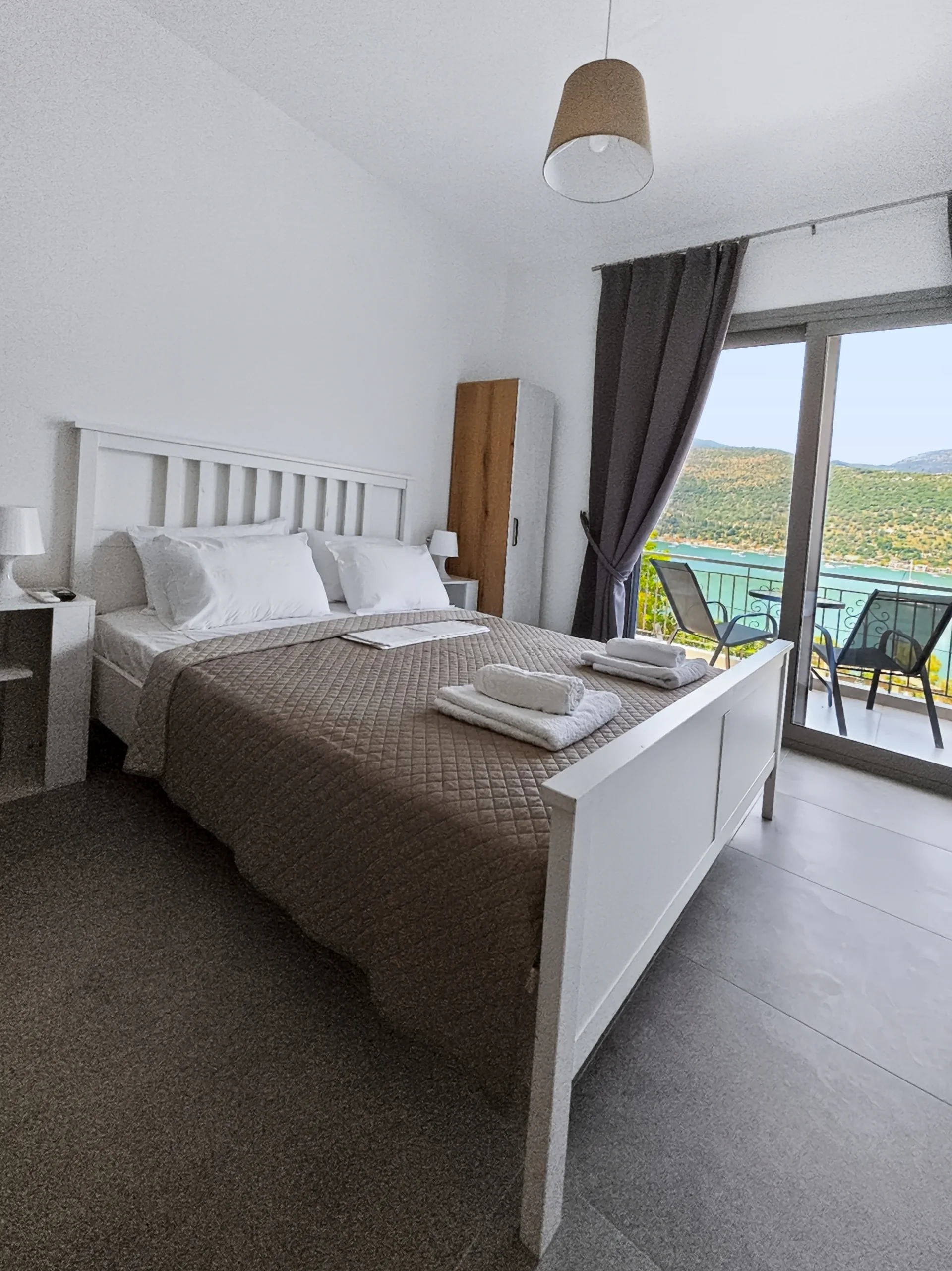 Studio 2: double bed beside the sea-view balcony in Geni, Lefkada