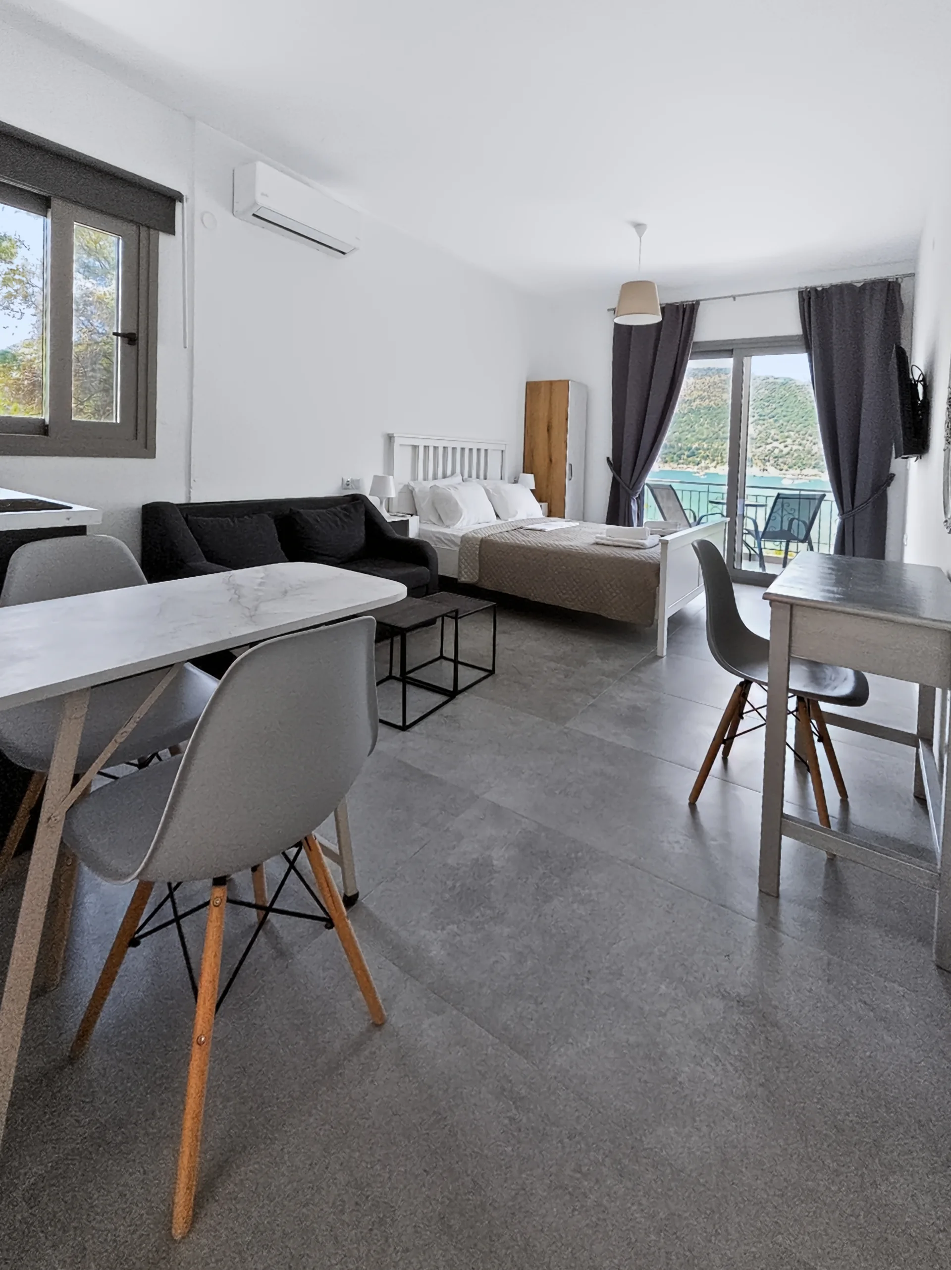 Studio 2: open-plan sleeping and living area at Chakalaka Resort
