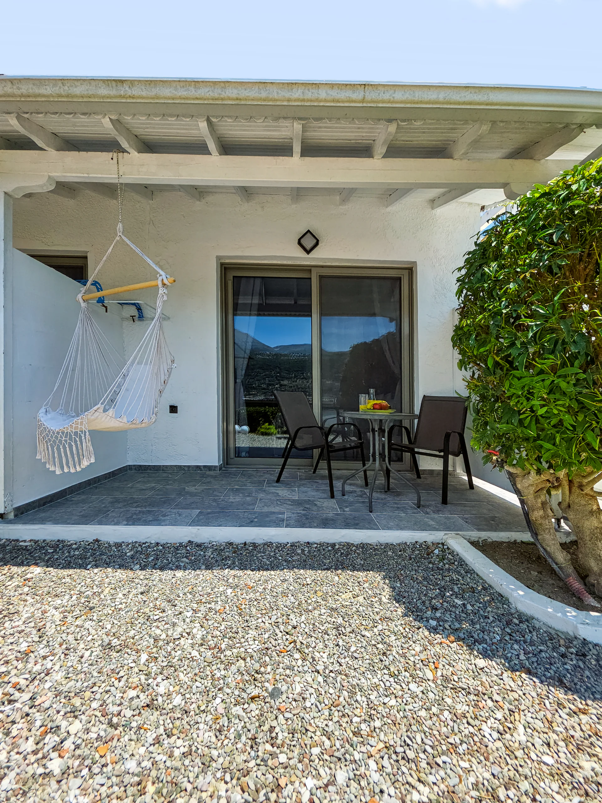 Studio 12: whitewashed exterior and private outdoor space in Geni