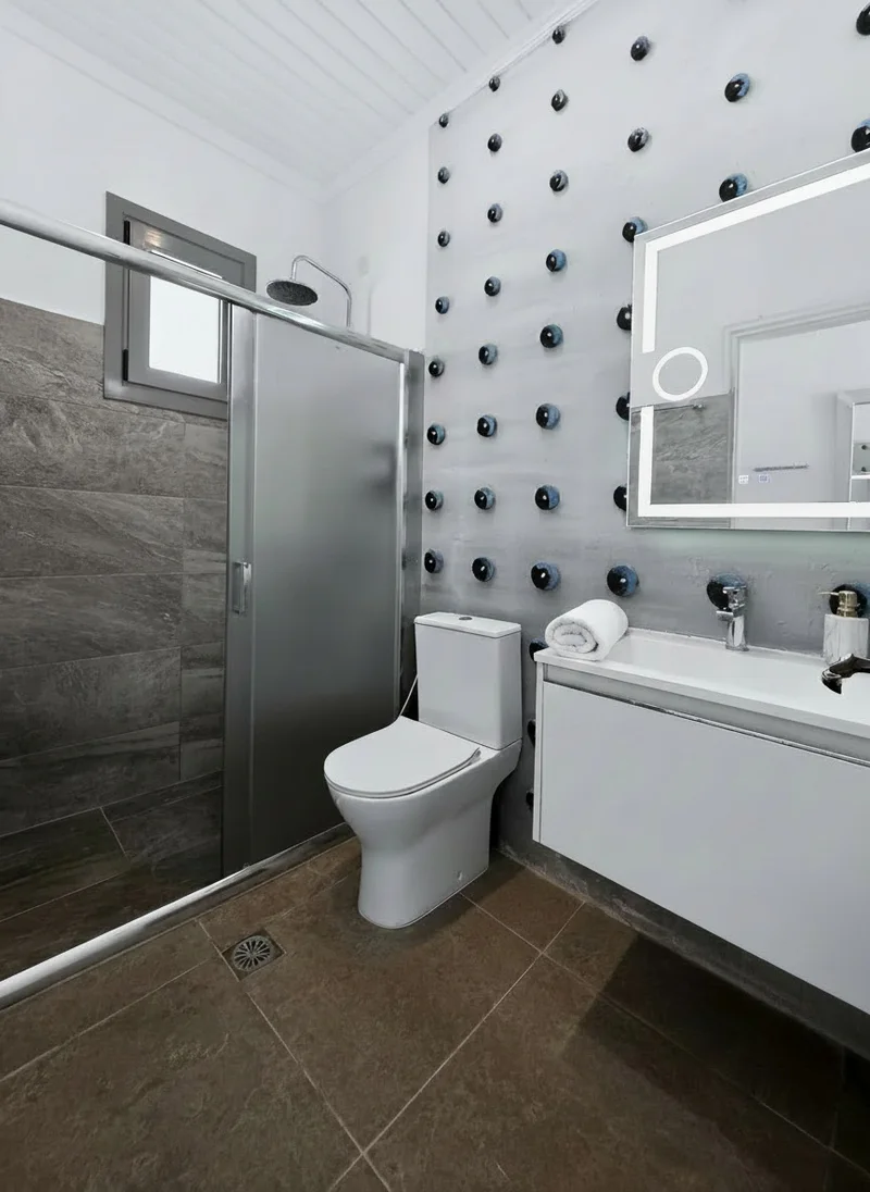 Studio 13: bright private bathroom with a walk-in shower