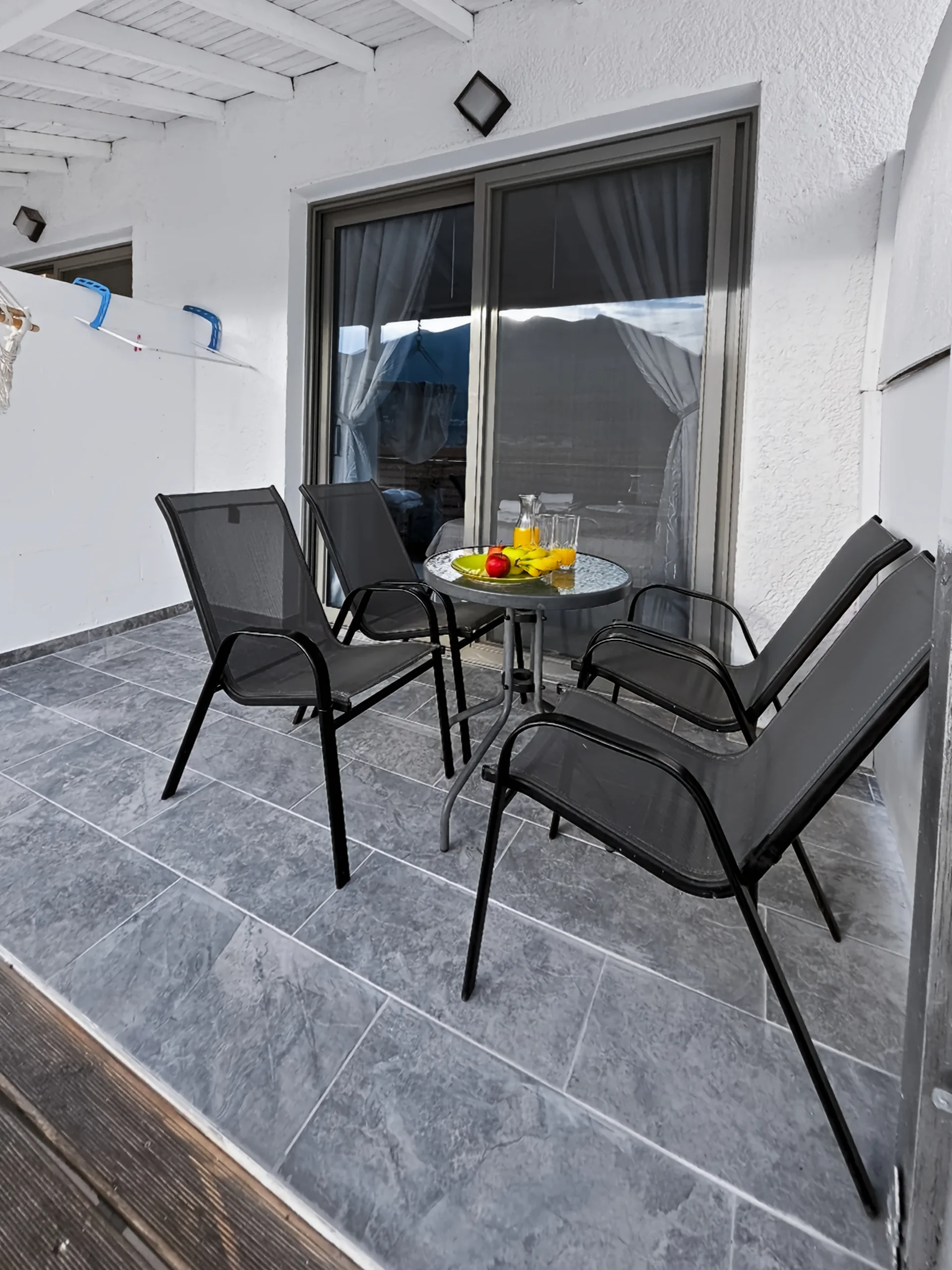 Studio 15: private balcony seating overlooking Geni Bay in Lefkada