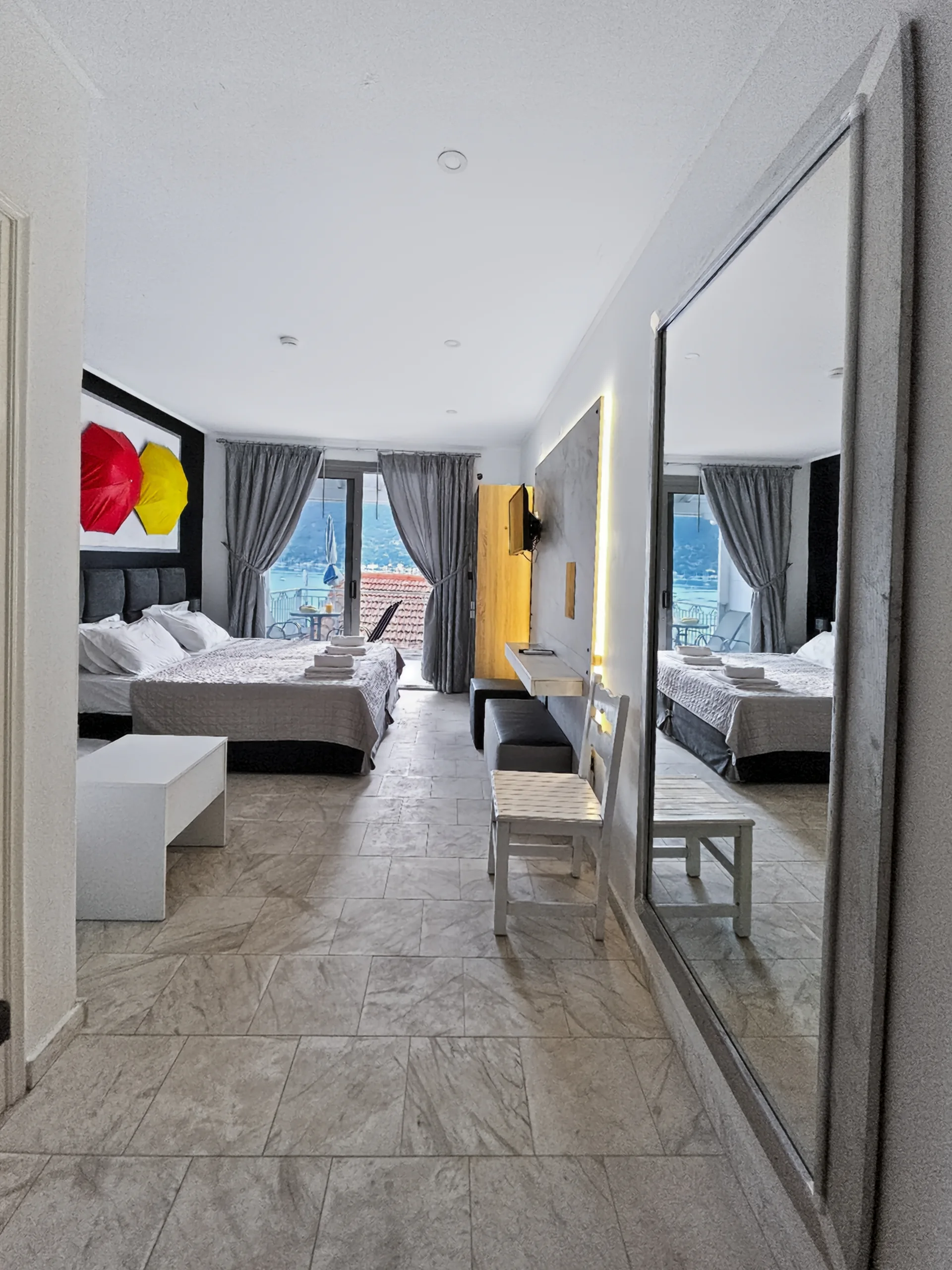 Studio 15: dressing table and mirror beside the sleeping area
