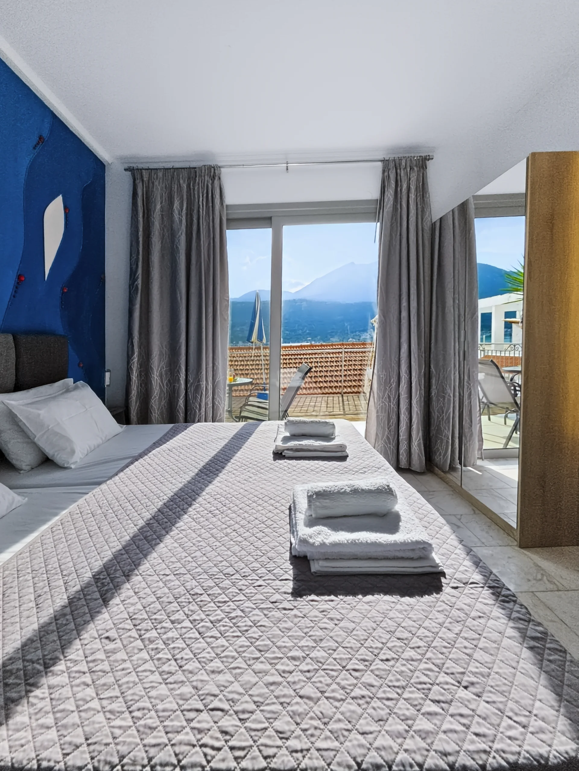 Studio 18: view across Geni Bay and the green hills of Lefkada