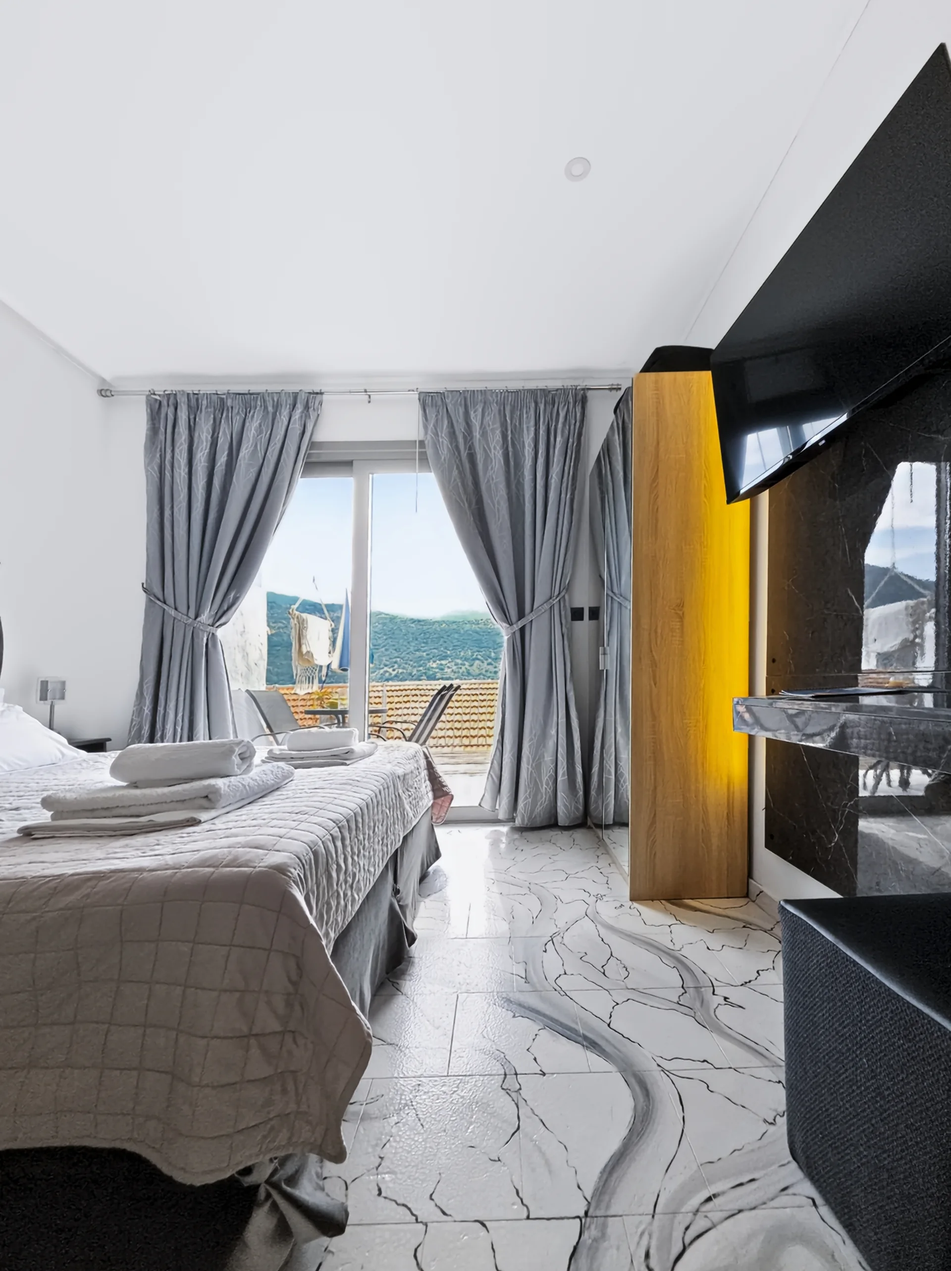 Studio 19: view across Geni Bay and the green hills of Lefkada