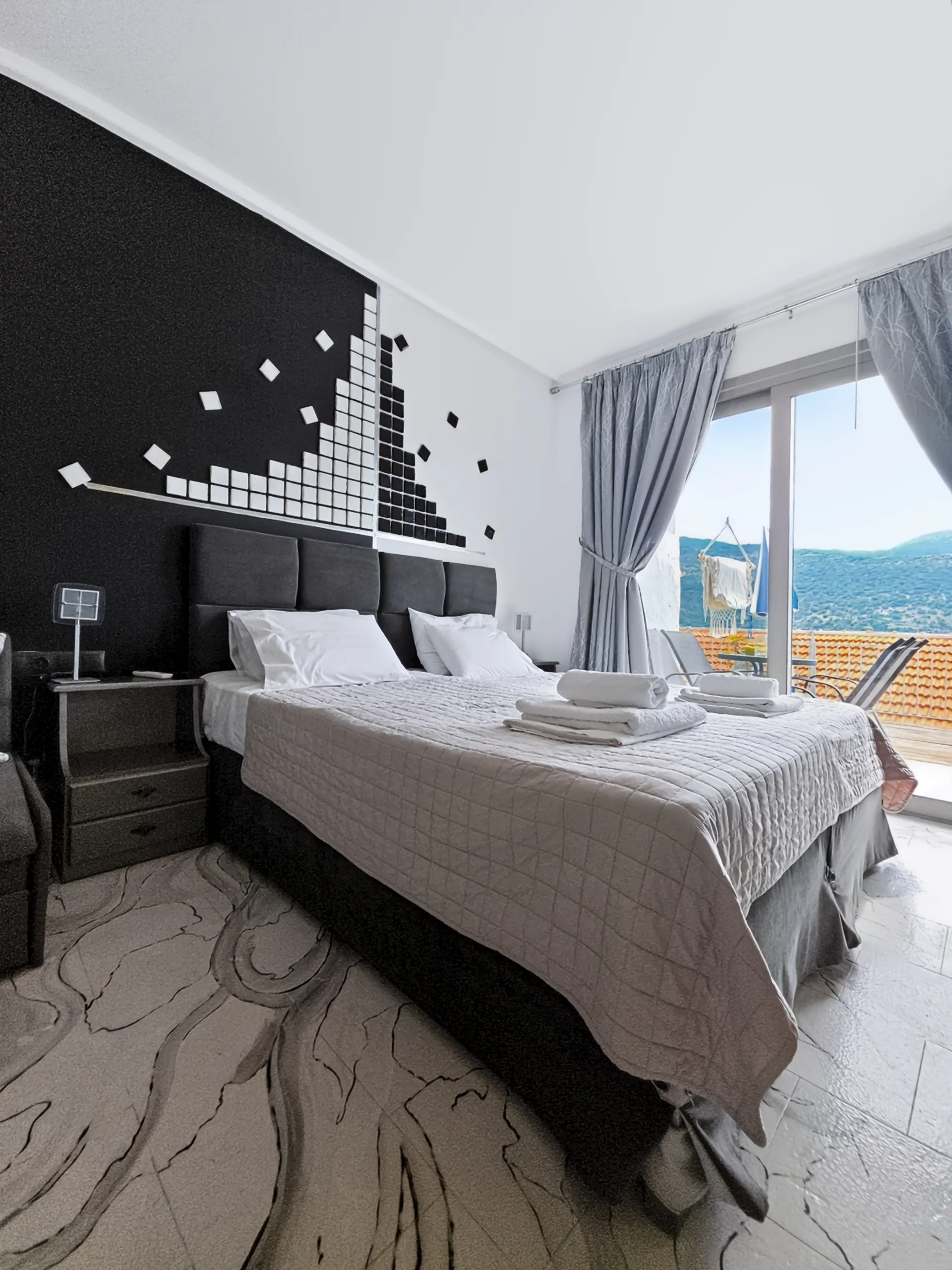 Studio 19: double bed beside the sea-view balcony in Geni, Lefkada