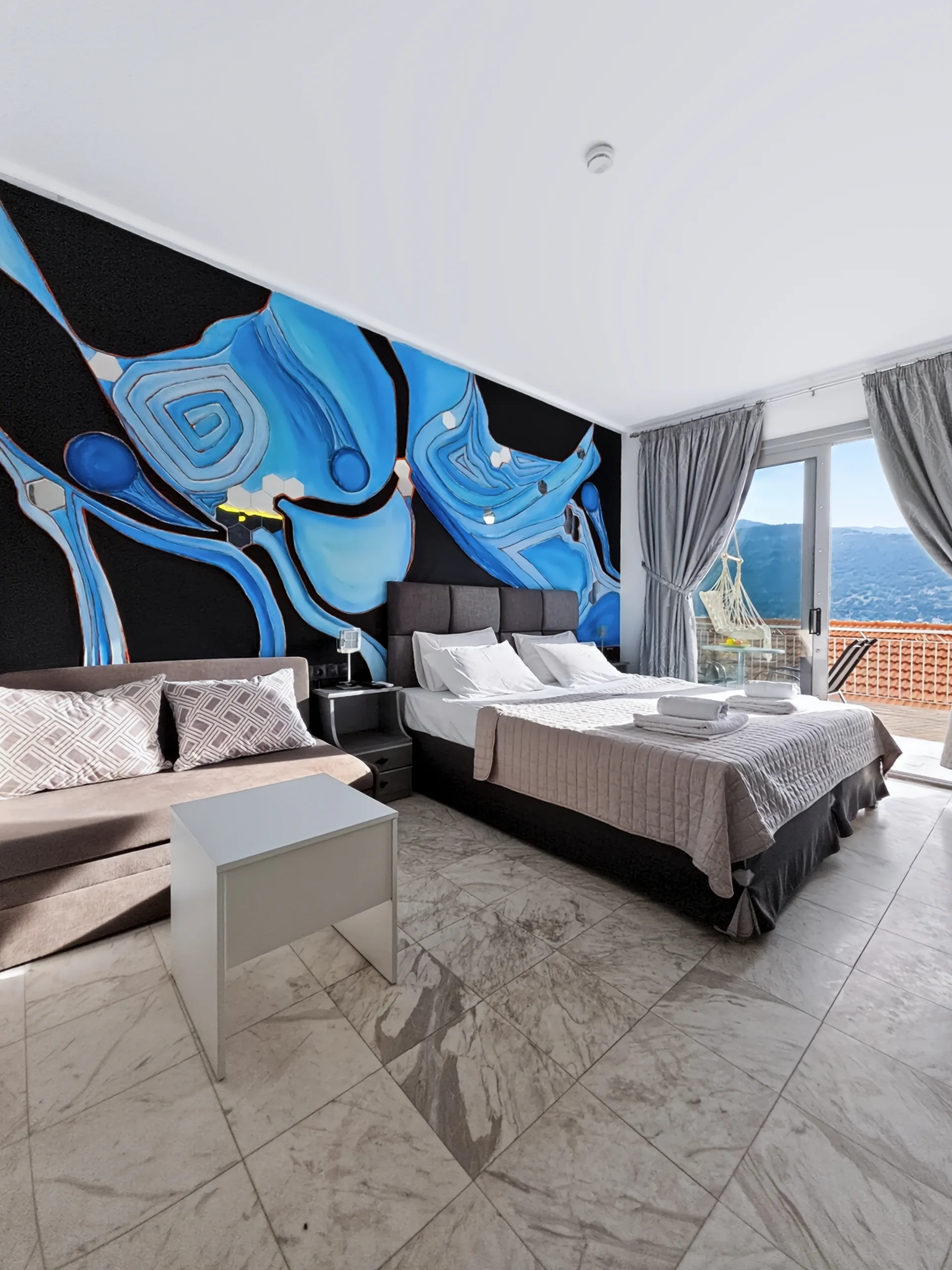 Studio 20: double bed beside the sea-view balcony in Geni, Lefkada