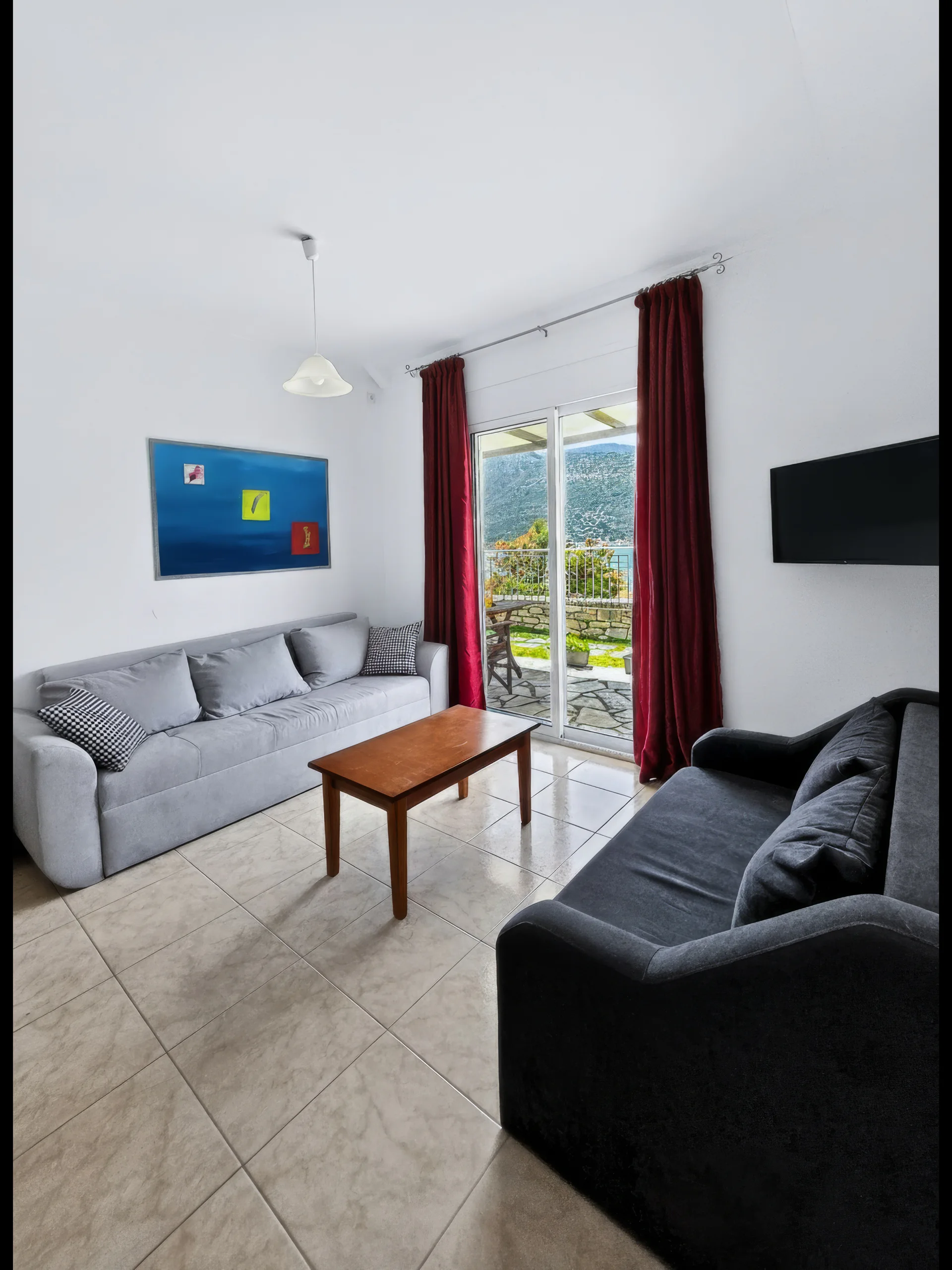 Villa 1: comfortable living room opening towards the outdoors