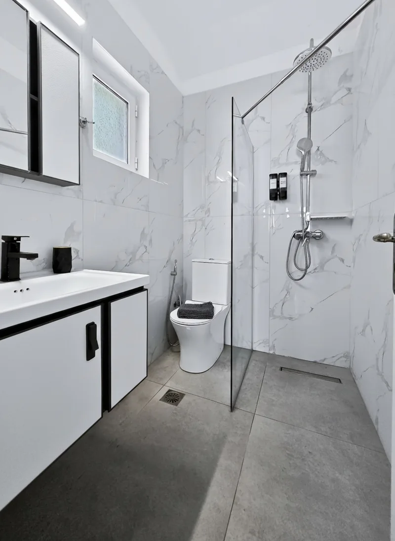Villa 1: bright private bathroom with a walk-in shower