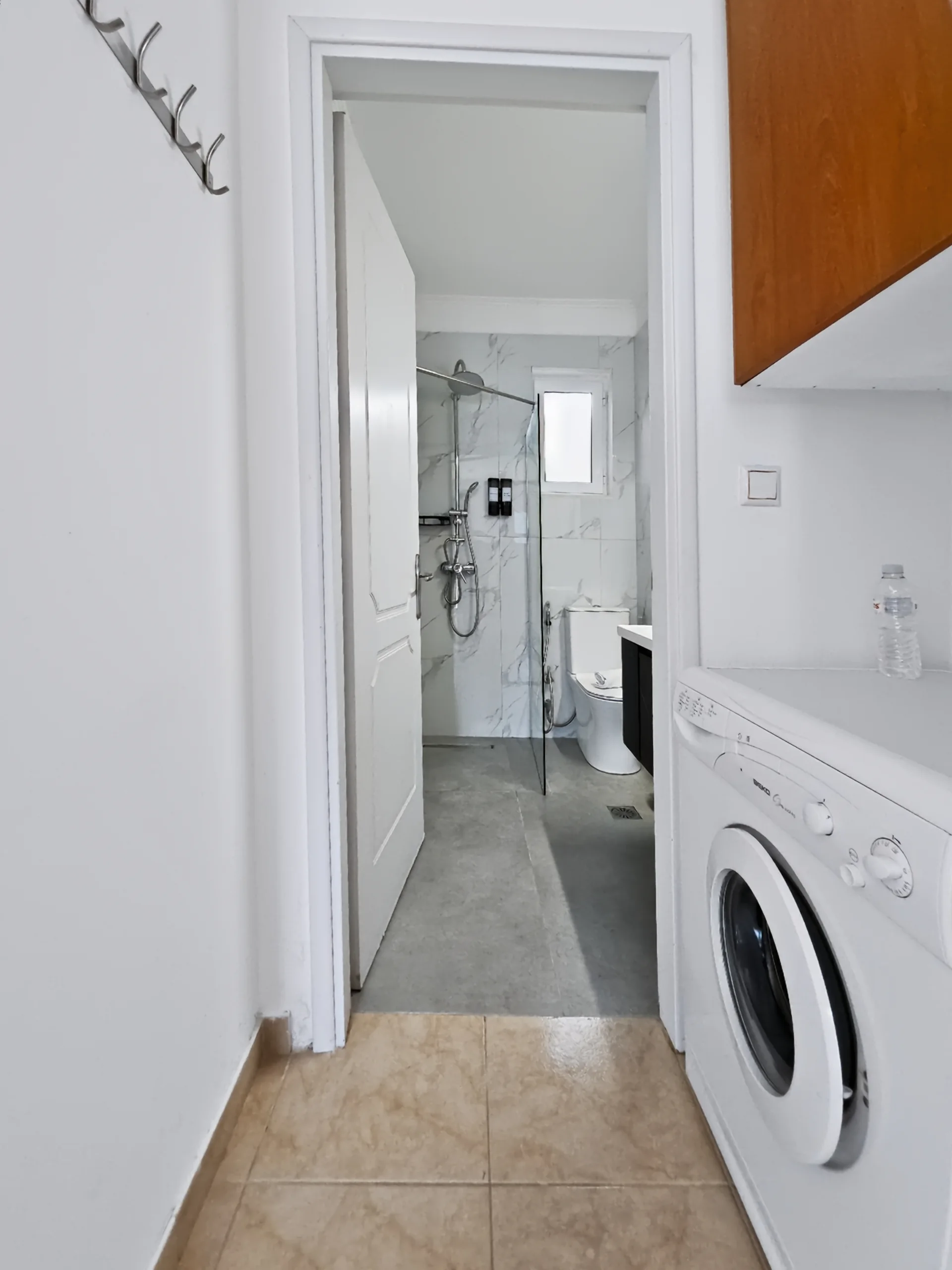 Villa 2: private laundry area beside the bathroom