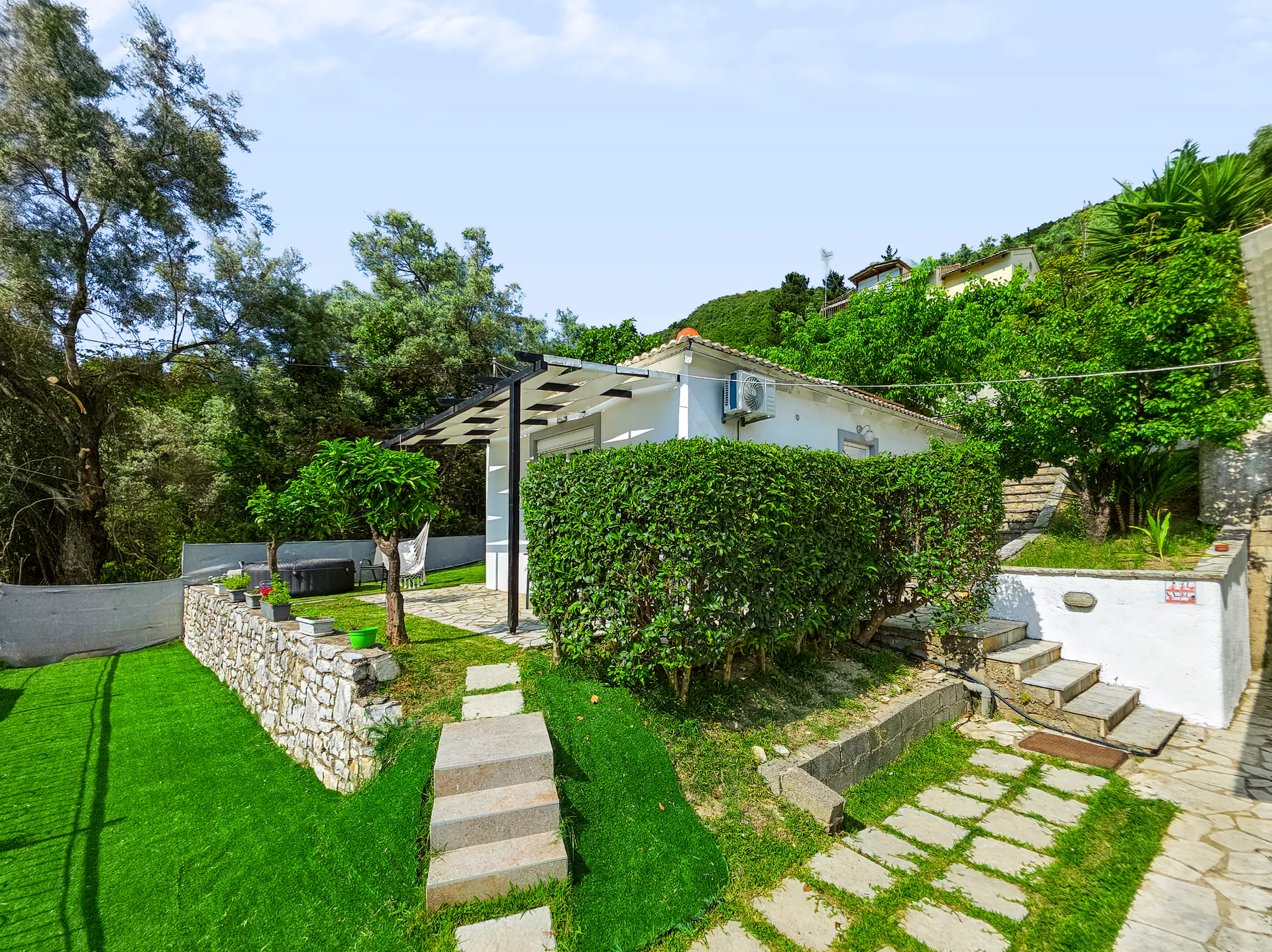 Villa 2: whitewashed exterior and private outdoor space in Geni