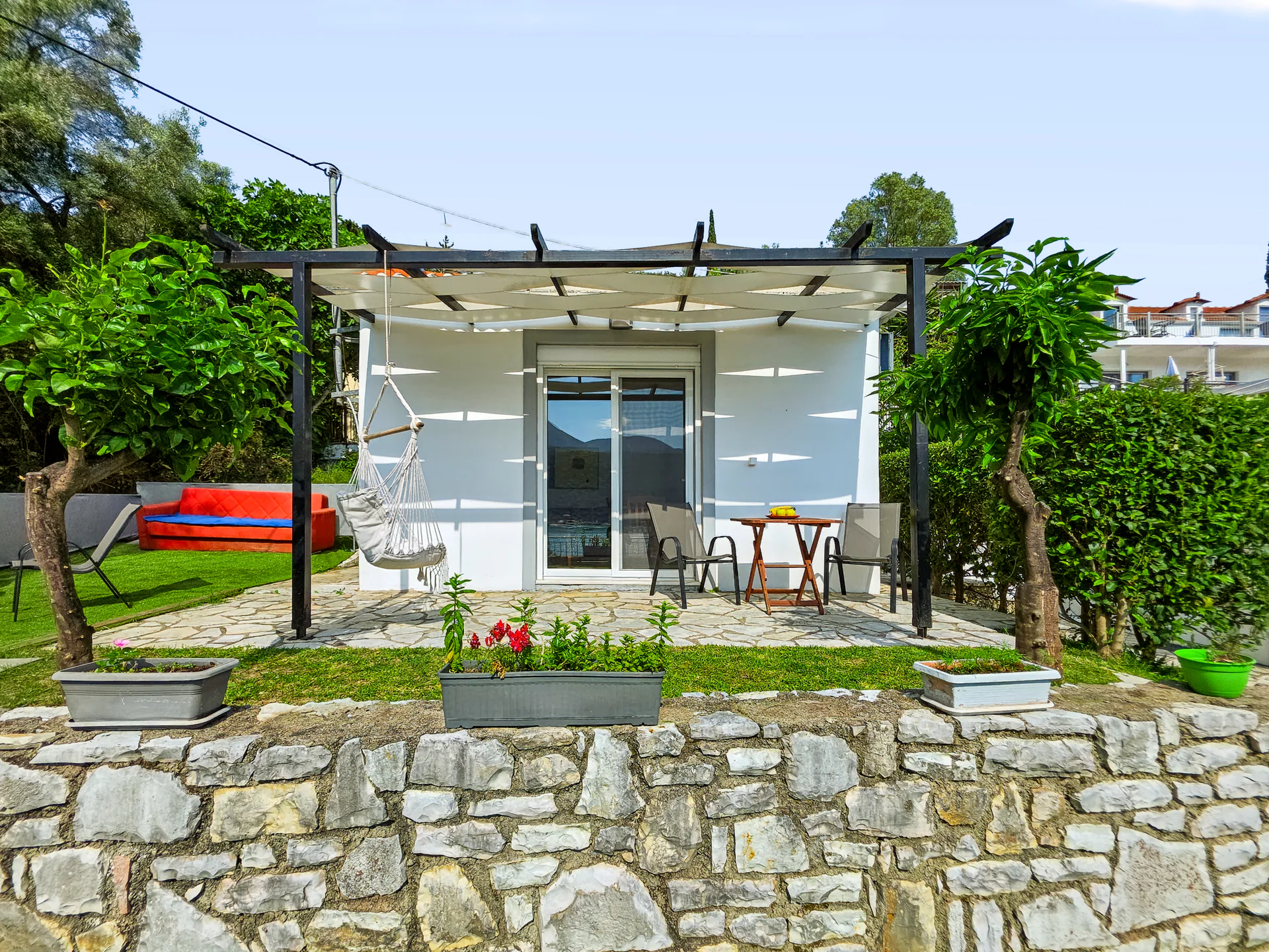 Villa 2: whitewashed exterior and private outdoor space in Geni