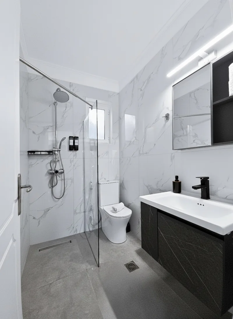 Villa 2: bright private bathroom with a walk-in shower
