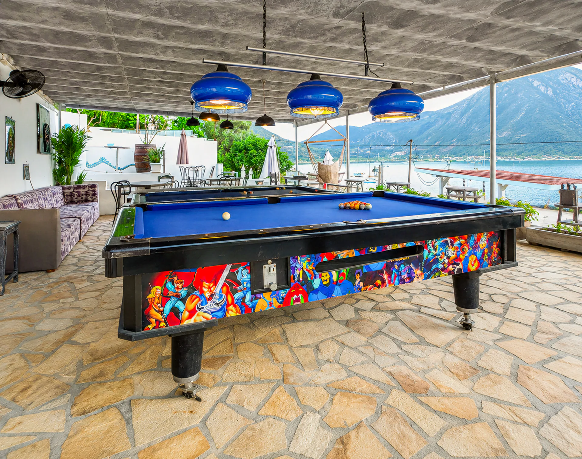 The colourful billiards table beside the bar with Geni Bay beyond
