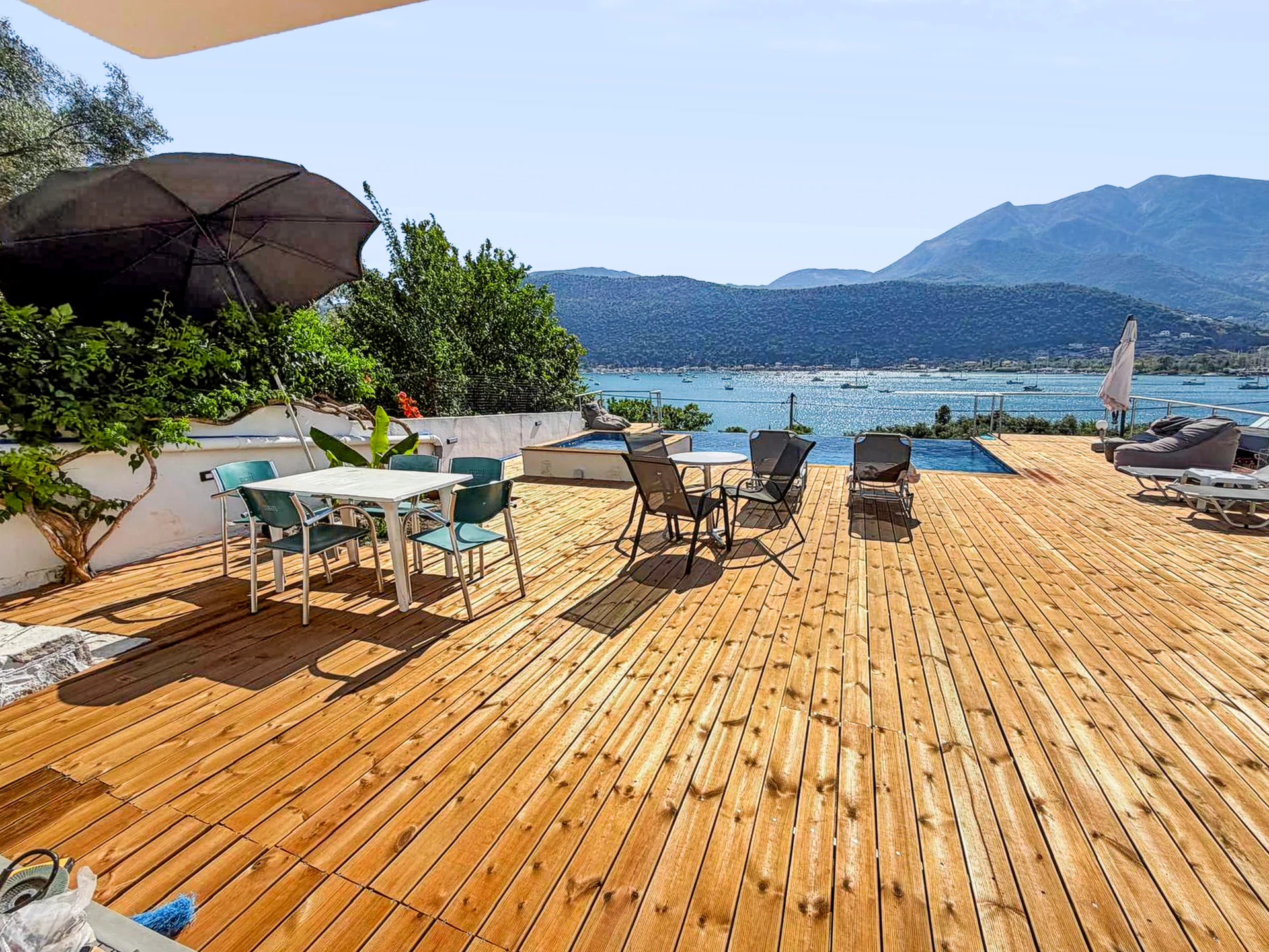 The sun deck, outdoor pool and wide view over Geni Bay at Chakalaka Resort
