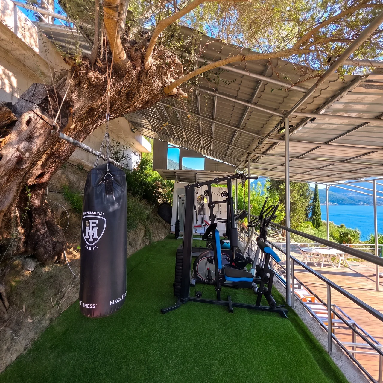 The covered open-air gym and training area overlooking Geni Bay