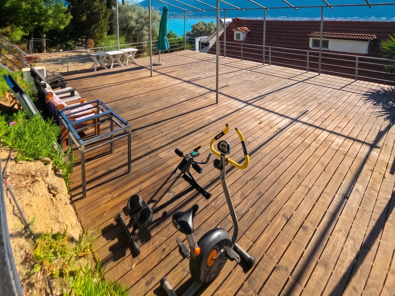 The open-air movement terrace facing Geni Bay for yoga and group retreats